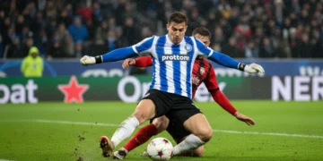 Defensive midfielder making a precise pass during a European football match
